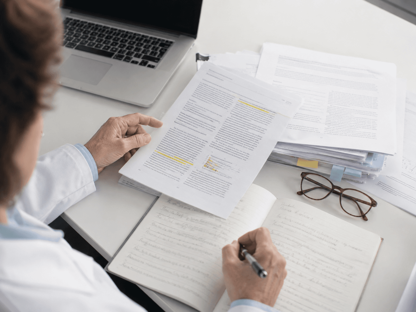 Researchers reviewing clinical evidence